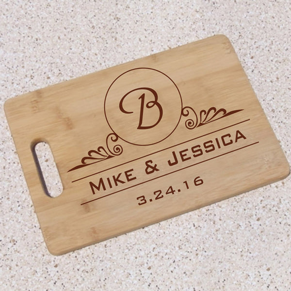 wood cutting board with initial, names and an additional text personalization line