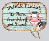 Funny cow magnet shaped like a speech bubble with rustic teal wood background, bold smiling cartoon cow with big teeth, and the phrase “Heifer Please – The Butter done slid off your Biscuit”