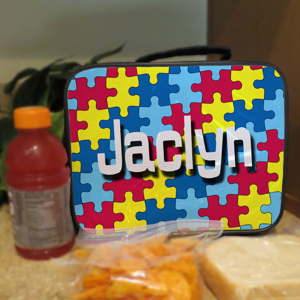 Lunch box with handle. Personalized with colorful Jigsaw Puzzle design and any name