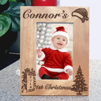 First Christmas Picture Frame for wide photos has santa hat, tree and santa with a scroll showing the year. You can use this frame for any Christmas, first, second, third etc