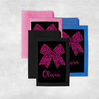 Cheer terms arranged to create a hair bow design on a custom wallet personalized with any name.