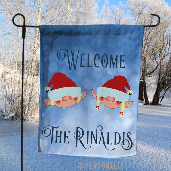 Elf couple yard flag personalized with any name and Christmas greeting.