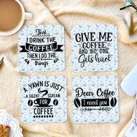 Set of 4 fabric coasters with rubber back. Coffee Cups randomly placed backdrop to four different funny sayings about coffee