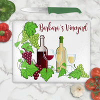 Any name personalized on this grapes, wine bottle and glasses theme cutting board