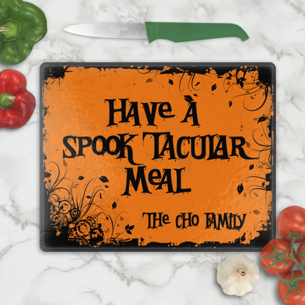 Spooky black and orange design cutting board for halloween personalized with any text