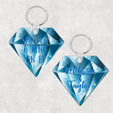 Diamond Shaped Key Ring with Blue Diamond Background 2 sided print one with names the other with SHe Put A Ring On It in Blue Text