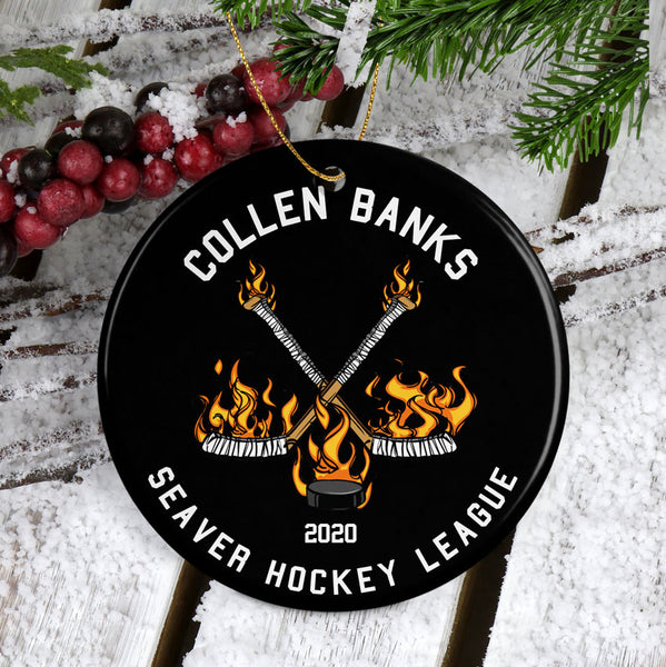 Personalized Round Porcelain Ornament with Black Background and Flaming Hockey Sticks and Puck design Personalized with three lines of text