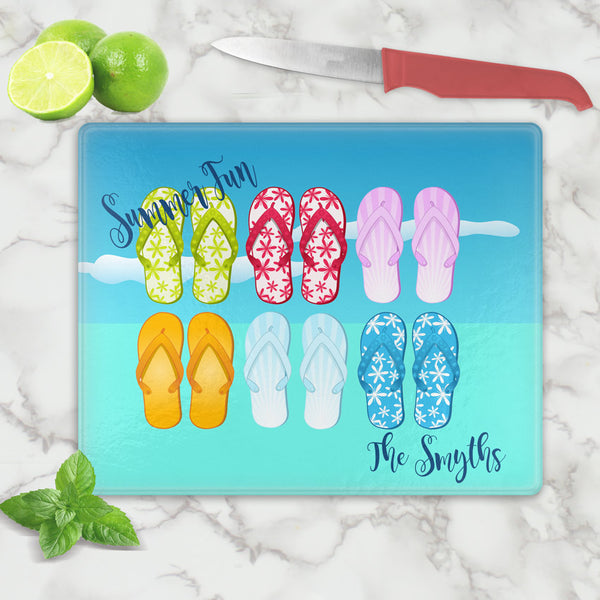 Glass Cutting Board  with assorted Flip Flops on a blue sky background personalized with any two lines of text