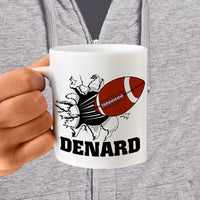 football breaking through a wall on a ceramic mug with any name personalized under the image.