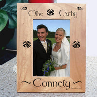 Wood Picture Frame for tall photos with Shamrocks and Swirls personalized with two names on top a last name on bottom and a date