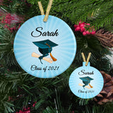 Personalized Christmas Ornaments with Shades of blue sunburst behind personalized text above and below an illustration of a graduation cap and diploma 