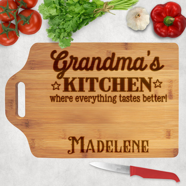 Whose kitchen is where everything tastes better? Wood cutting board with personalized title and name