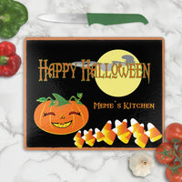 Glass Cutting Board with Happy face pumpkin with yellow moon and candy corn with your personalized Halloween message and name