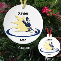 Hockey Player skating with yellow flash behind him on both porcelain and plastic ornament