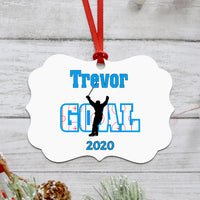 Benelux Curved shape Christmas Ornament with Hockey player and rink within the word Goal behind the player with stick in the air after scoring. Personalized with name and year or any custom text