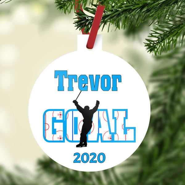Ball shaped christmas ornament with stem personalized with hockey player skating with stick up in air to indicate he just scored (not high sticked the opposing player lol) Any name on top and year on bottom.