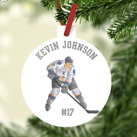 Plastic ornament 3: diameter. Hockey Player with stick and your personalized text.