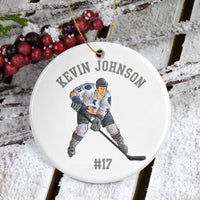 Porcelain ornament 2-7/8 diameter. Hockey Player with stick and your personalized text.