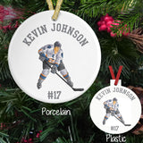 Hockey player personalized ornaments available on both a plastic or porcelain round ornament with your custom text.