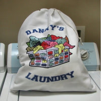 draw string tote with illustration of laundry basket and dirty clothes and any personalized text