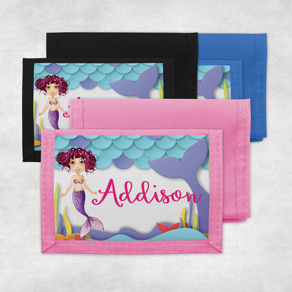 mermaid wallets offered in pink, blue or black