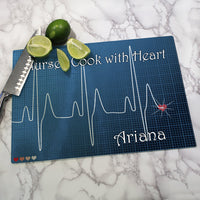 ekg line with heart at the end cutting board