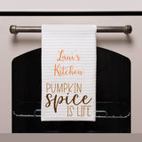 waffle weave towel shown on an oven handle with personalization and design saying "Pumpkin Spice is Life"
