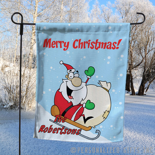 Personalized Yard Flag with Santa sledding down a hill with personalized merry christmas greeting and any name