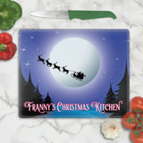 Glass Cutting board with  Santa's sleigh and reindeer flying across the moon and personalized with any text