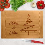 simple christmas tree design on a wood cutting board with butcher block ends. Your personalized text on the left with tree on the right