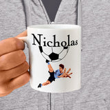 Personalized Ceramic Mug with Soccer Player extending leg to kick ball and name printed above half ball