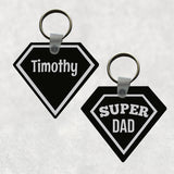 Daimond-Pentagon Shaped Key Ring Black Background with silver-gray super hero outline and Super dad on one side Personalized name on other side