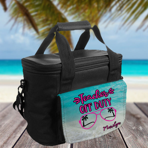 Teacher Off Duty Sunglasses with palm trees inside on sand with turqoise beach water on a large lunch cooler