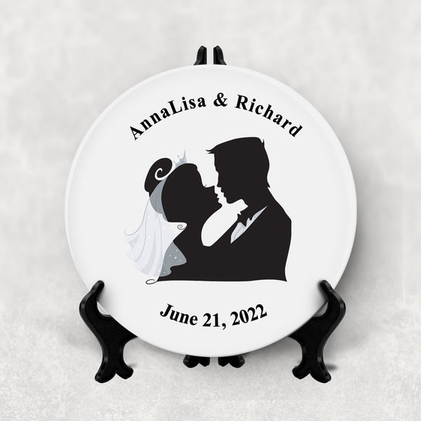 Lovely porcelain plate with a silhouette image of a bride and groom and your names arched on top and date on bottom