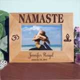 4 x 6 yoga design wood picture frame wide view of Namaste on top Ohm Symbol on left and meditator sitting in lotus position on right. Personalized 2 lines of text on bottom